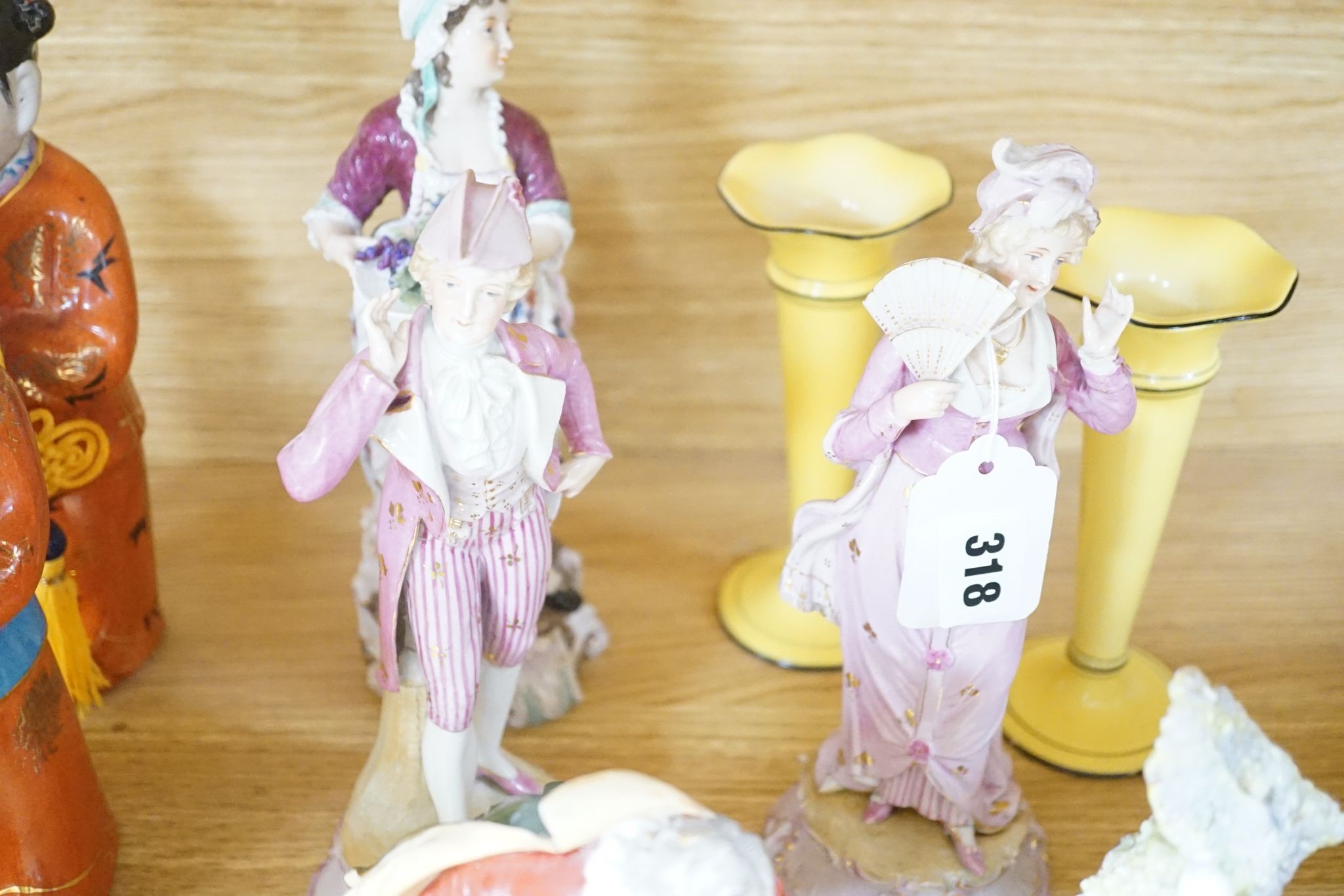 A collection of German and French porcelain figurines, Coalport commemorative urn etc.